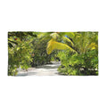 Jungle Trail Palms beach towel laid flat: sunlit palm fronds and tropical greenery along a sandy trail