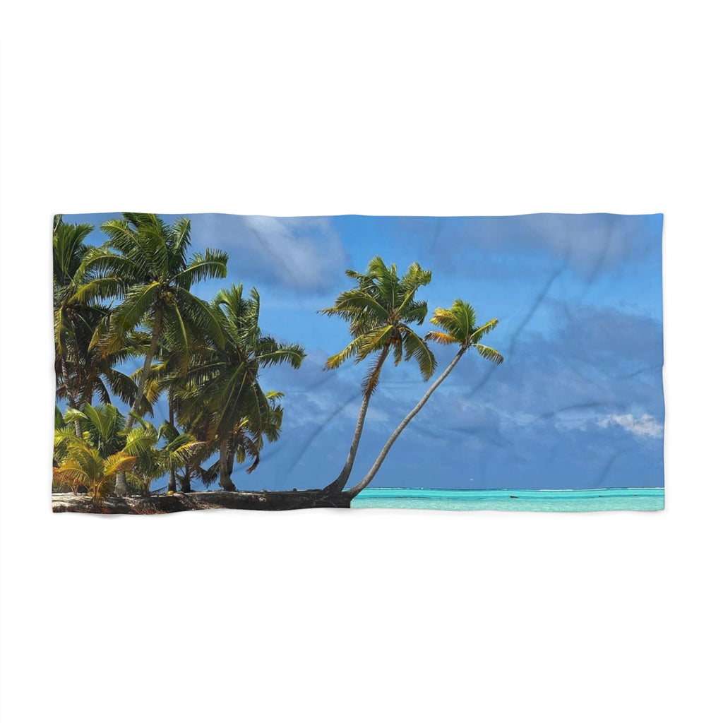 Leaning Palms Seaside beach towel laid flat, showing palms leaning over turquoise water under a blue sky