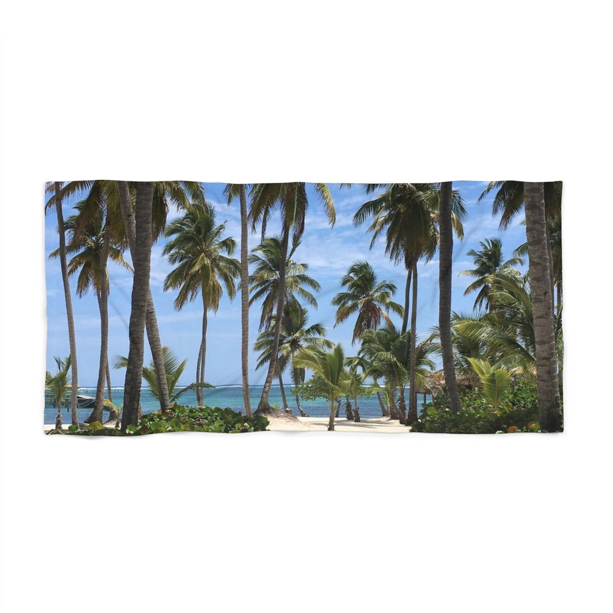 Palm Grove Shoreline beach towel laid flat, showing rows of tall palms framing a glimpse of blue sea