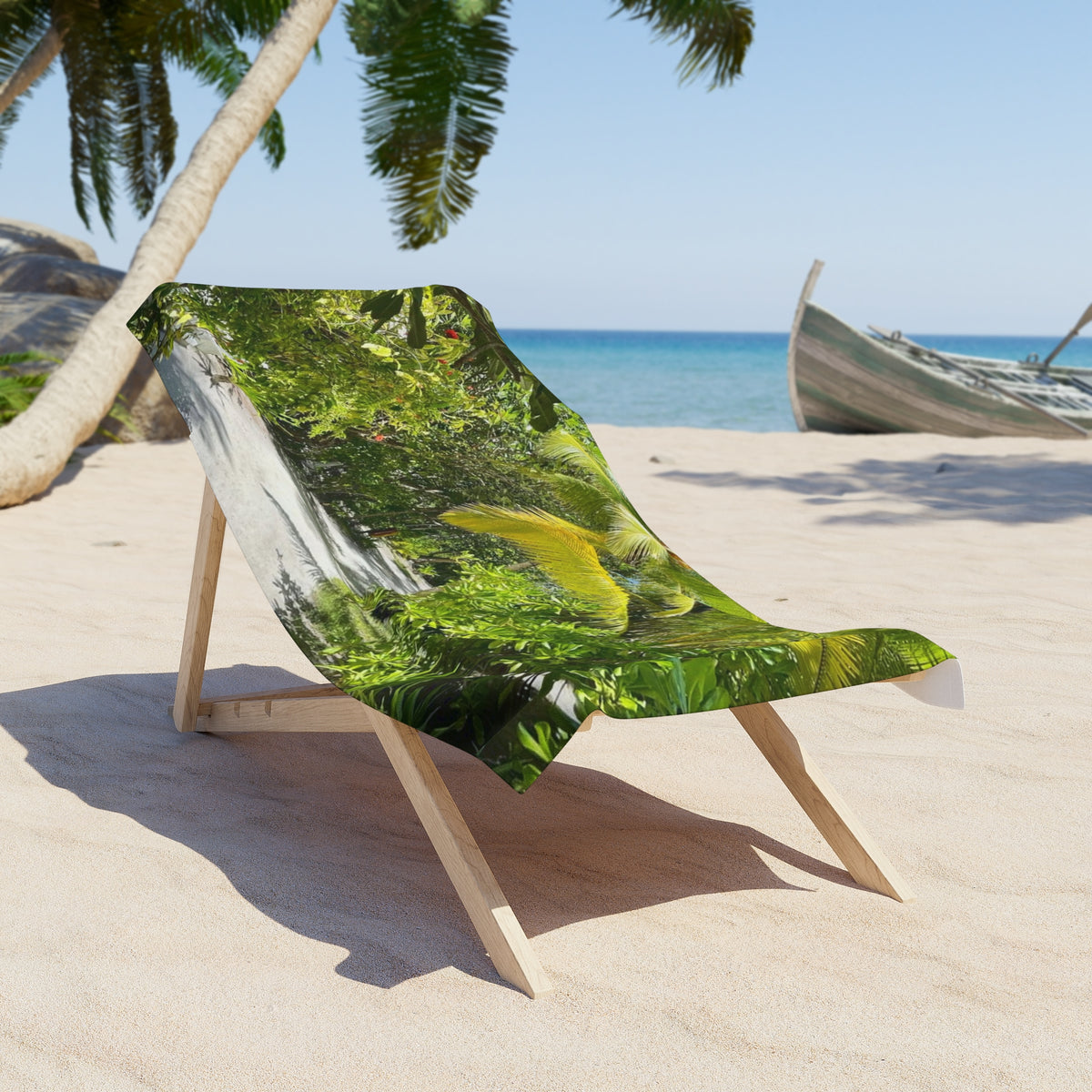 Jungle Trail Palms beach towel draped over a wooden beach chair on the sand (chair not included)